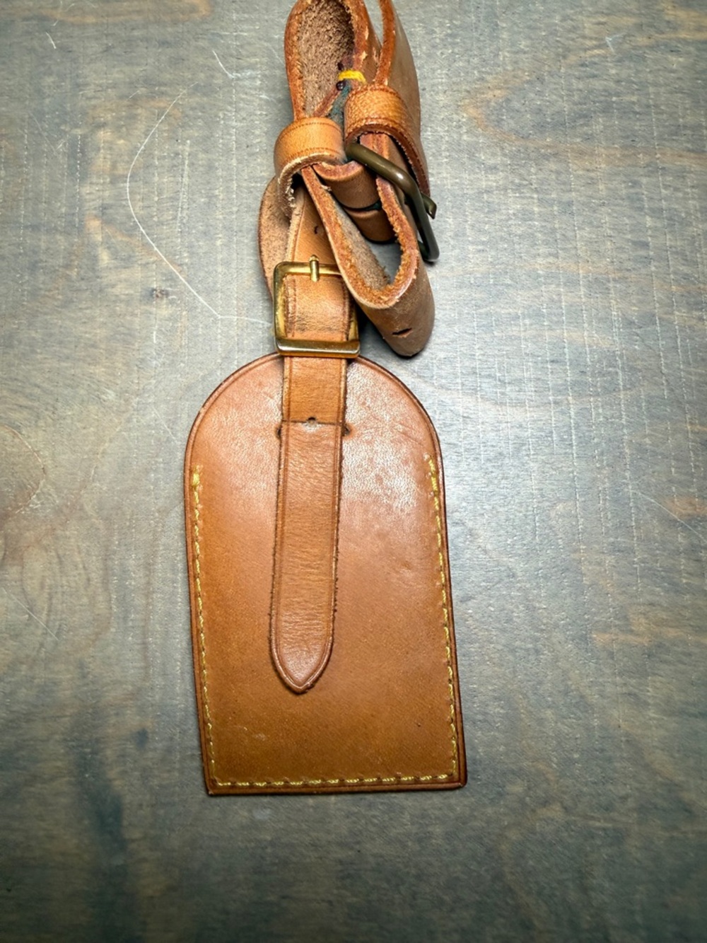 vintage collectible is a Louis Vuitton natural vachetta leather luggage tag